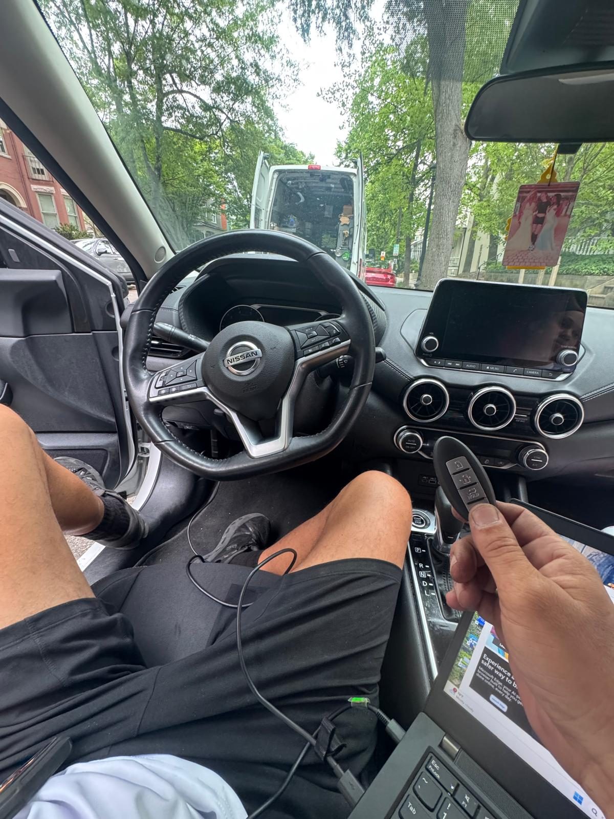 Automotive key fob programming in progress for a Nissan