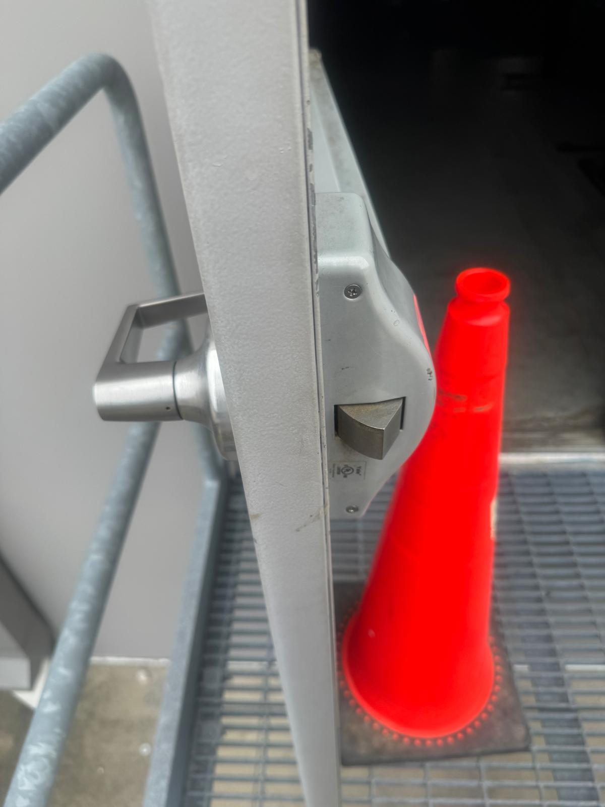 Close-up of a panic bar exit device installation